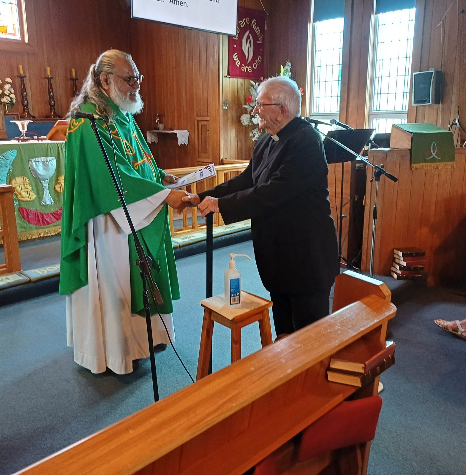 Father Turi shaking hands
